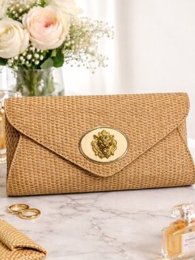 Wimberly Woven Straw Envelope Clutch in Natural with Gold Lion Emblem